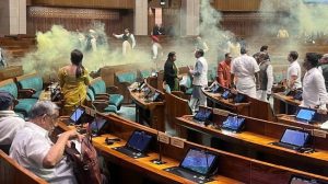 Huge security breach in Lok Sabha 2 intruders jump from gallery spray gas