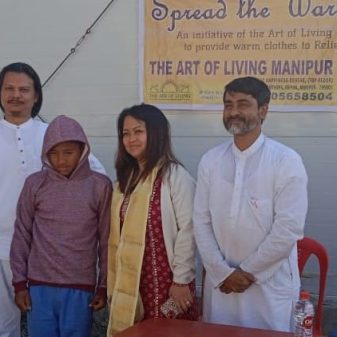 Children at Temporary Shelter received warm clothes from Art of Living